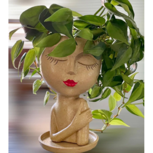 Art deco bust of a women with a plant planter for a head.